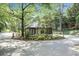 A charming entrance building is nestled amongst trees, providing privacy to residents at 117 Lablanc Nw Way, Atlanta, GA 30327