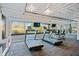 The community gym features treadmills and large windows overlooking a treed outdoor area at 117 Lablanc Nw Way, Atlanta, GA 30327