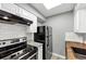 Bright kitchen with subway tile backsplash and stainless steel refrigerator at 117 Lablanc Nw Way, Atlanta, GA 30327