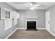 Bright living room featuring hardwood floors, fireplace, and windows with shuttered blinds at 117 Lablanc Nw Way, Atlanta, GA 30327