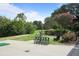 Well-maintained putting green with scenic views, lush landscaping, and nearby seating for players and spectators at 117 Lablanc Nw Way, Atlanta, GA 30327