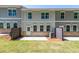 View of the home's backyard with a concrete patio, lawn, and privacy fencing at 1604 Ruskin Way, Marietta, GA 30062