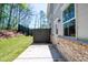 This backyard has a concrete patio, a wood fence, and a grassy area at 1604 Ruskin Way, Marietta, GA 30062