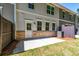The backyard has a concrete patio, grass, fencing and an AC unit at 1604 Ruskin Way, Marietta, GA 30062