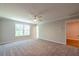 Bright bedroom offering a ceiling fan, ample space, and scenic outdoor views at 1604 Ruskin Way, Marietta, GA 30062
