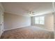 Spacious bedroom featuring a ceiling fan, and large windows with natural light at 1604 Ruskin Way, Marietta, GA 30062