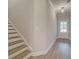 Entryway with stairs to the second floor and an entrance to the lower level of the home at 1604 Ruskin Way, Marietta, GA 30062