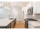 Modern kitchen with quartz countertops, stainless steel appliances, and stylish lighting at 1604 Ruskin Way, Marietta, GA 30062