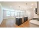 Open kitchen featuring an island with a dishwasher, stove, and stainless steel appliances at 1604 Ruskin Way, Marietta, GA 30062
