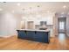 Bright kitchen with a large island, stainless steel appliances, and hardwood floors at 1604 Ruskin Way, Marietta, GA 30062