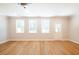 Bright living room featuring hardwood floors, recessed lighting, a ceiling fan, and exterior view at 1604 Ruskin Way, Marietta, GA 30062