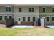 View of the home's backyard and patio, surrounded by lush greenery at 1612 Ruskin Way, Marietta, GA 30062