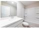 Clean bathroom with a white vanity, large mirror, and shower-tub combo at 1612 Ruskin Way, Marietta, GA 30062