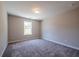 Spacious bedroom features plush carpet, natural light, and a modern ceiling light at 1612 Ruskin Way, Marietta, GA 30062