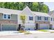 Attractive townhome exteriors showcasing a blend of brick and siding, creating an inviting and modern curb appeal at 1612 Ruskin Way, Marietta, GA 30062