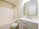 Bathroom featuring modern vanity, and shower-tub combo at 1670 Granville Ct, Lawrenceville, GA 30043