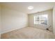 Bedroom featuring carpeted floor and window at 1670 Granville Ct, Lawrenceville, GA 30043