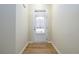 Bright entryway with hardwood floors and white door with window at 1670 Granville Ct, Lawrenceville, GA 30043