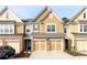 Charming townhome with two-car garage and attractive curb appeal at 1670 Granville Ct, Lawrenceville, GA 30043