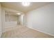 Well-lit hallway with neutral carpeting, creating a seamless flow throughout the home at 1670 Granville Ct, Lawrenceville, GA 30043