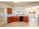 Well lit kitchen showcasing dark cabinetry, granite countertops, stainless appliances, and an open concept design at 1670 Granville Ct, Lawrenceville, GA 30043