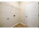 Convenient laundry room featuring storage rack and a door to the exterior at 1670 Granville Ct, Lawrenceville, GA 30043