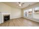 Bright living room with fireplace, ceiling fan, and large windows at 1670 Granville Ct, Lawrenceville, GA 30043