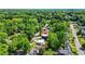 An aerial shot of a home nestled among lush trees in a serene residential neighborhood at 237 Altoona Sw Pl, Atlanta, GA 30314