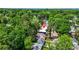 An aerial view showcases the property nestled among lush trees in a quiet neighborhood at 237 Altoona Sw Pl, Atlanta, GA 30314