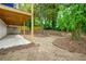 Landscaped backyard with a covered patio for outdoor entertaining and leisure at 237 Altoona Sw Pl, Atlanta, GA 30314