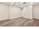 Unfurnished basement featuring new wood-look flooring and recessed lighting at 237 Altoona Sw Pl, Atlanta, GA 30314