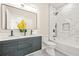 Modern bathroom with double sink vanity, marble tile, and sleek black fixtures at 237 Altoona Sw Pl, Atlanta, GA 30314