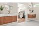 Modern bathroom with floating wood vanity, marble countertop, and sleek fixtures, open to the primary bedroom at 237 Altoona Sw Pl, Atlanta, GA 30314