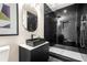 Modern bathroom showcasing a sleek black vanity, spacious shower, and stylish tile at 237 Altoona Sw Pl, Atlanta, GA 30314