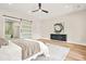 Bedroom featuring modern decor, with sliding barn door to Primary bathroom and accent console at 237 Altoona Sw Pl, Atlanta, GA 30314