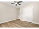 Bedroom with wood-look floors, closet and modern ceiling fan at 237 Altoona Sw Pl, Atlanta, GA 30314