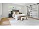 Bedroom showcasing a plush bed, decorative pillows, and a stylish sliding barn door entrance at 237 Altoona Sw Pl, Atlanta, GA 30314