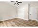 Spacious bedroom featuring modern ceiling fan, wood-look flooring, and double door closet at 237 Altoona Sw Pl, Atlanta, GA 30314