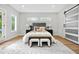 Bedroom showcasing a plush bed, decorative pillows, and a stylish sliding barn door entrance at 237 Altoona Sw Pl, Atlanta, GA 30314