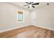 Well-lit bedroom with neutral walls, wood-look floors and a large window at 237 Altoona Sw Pl, Atlanta, GA 30314