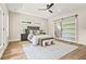 Bedroom with modern decor, ceiling fan, and sliding barn door at 237 Altoona Sw Pl, Atlanta, GA 30314