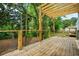 Spacious wooden deck surrounded by lush greenery, perfect for outdoor relaxation and entertaining at 237 Altoona Sw Pl, Atlanta, GA 30314