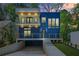 Modern home showcasing a striking blue exterior with a balcony and a well-manicured front yard at 237 Altoona Sw Pl, Atlanta, GA 30314
