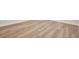 Close-up of new light brown wood-look flooring, installed with white trim at 237 Altoona Sw Pl, Atlanta, GA 30314