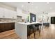 Contemporary kitchen with a spacious island, bar seating, sleek cabinetry, and modern finishes that complement the open layout at 237 Altoona Sw Pl, Atlanta, GA 30314