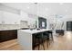 Modern kitchen with an island, featuring sleek cabinetry, stainless steel appliances, and hardwood floors at 237 Altoona Sw Pl, Atlanta, GA 30314