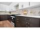 Modern kitchen with stainless steel appliances, stylish cabinetry, and elegant countertops at 237 Altoona Sw Pl, Atlanta, GA 30314