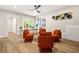 Stylish living room features modern decor, comfortable orange seating, and neutral paint at 237 Altoona Sw Pl, Atlanta, GA 30314