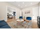 Bright living room with stylish decor, hardwood floors, and an open layout to the dining area at 237 Altoona Sw Pl, Atlanta, GA 30314