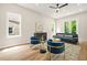 Cozy living room featuring hardwood floors, modern furniture, and natural light from large windows at 237 Altoona Sw Pl, Atlanta, GA 30314